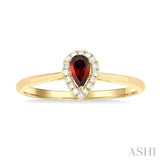 5x3 MM Pear Shape Garnet and 1/20 Ctw Single Cut Diamond Halo Semi-Precious Ring in 14K Yellow Gold
