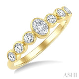 1/2 Ctw Bezel Set Oval and Round Cut Diamond Fashion Band in 14K Yellow Gold